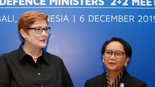Indonesia Foreign Minister Retno Marsudi, right, greets her Australia counterpart Marise Payne
