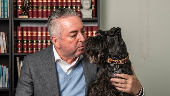 Michael Tiyce, pictured with his schnauzer Ferdinand, said the family law changes applied to all current court disputes except those at the stage of a final hearing.
