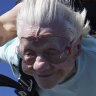 Dorothy Hoffner, 104, falling through the air with tandem jumper Derek Baxter.