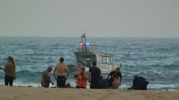 Rescuers tried to save three men after they got into trouble in the water.
