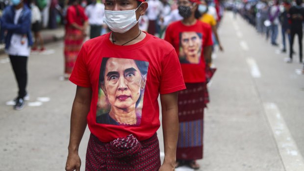A man wears a T-shirt imprinted with an image of Myanmar's leader Aung San Suu Kyi in July.