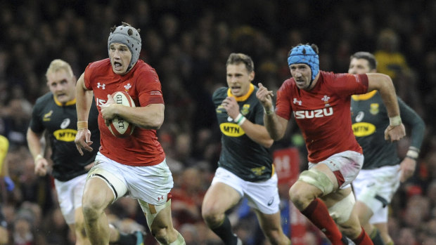 Galloping: Welshman Jonathan Davies makes a break during their victory over South Africa.