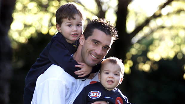 Ben Silvagni (1) with brother Jack (3) and dad Stephen before the latter's 300th game in 2001.