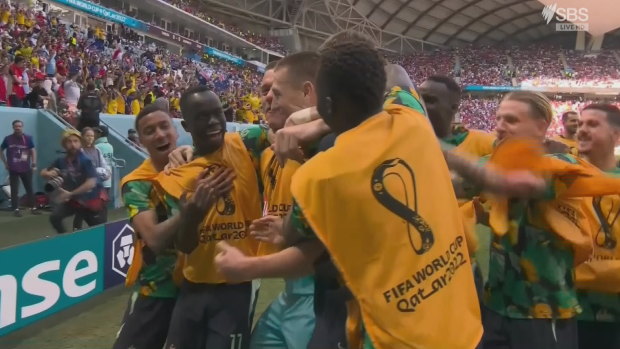 The Socceroos celebrate the opening goal of the game.