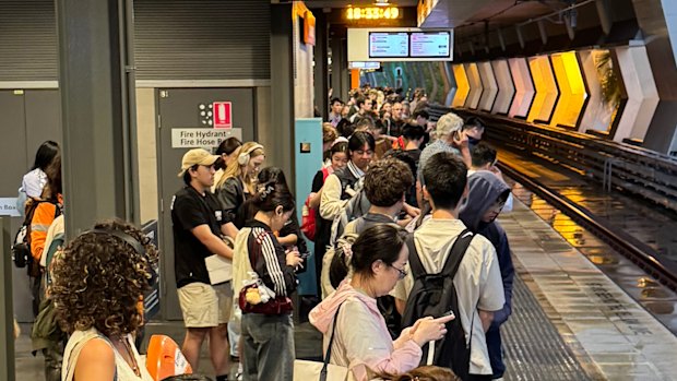 Commuters waiting at Chatswood station during the storm.