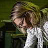 Sydney Morning Herald editor Jordan Baker looking at old editions in the Fairfax archives.