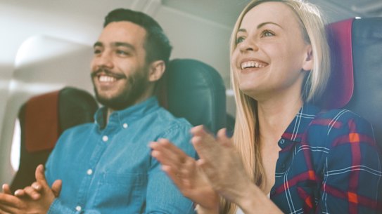 clapping plane passengers