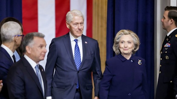 Former president Bill Clinton and former first lady and secretary of state Hillary Clinton arrive at the ceremony. 