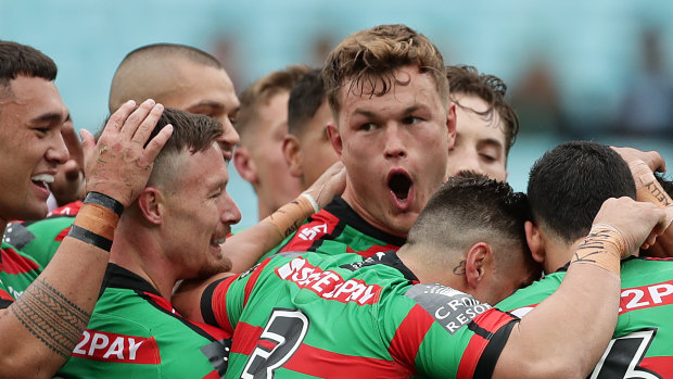 The Rabbitohs celebrate a try against the Sharks in round one. When will they get to do it again?