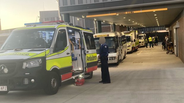 The school bus amid multiple ambulances at Roma Hospital.