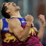 Charlie Cameron of the Lions celebrates a goal.