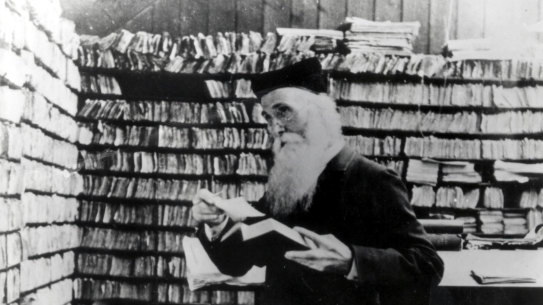 Sir James Murray, first editor of the Oxford English Dictionary, surrounded by files of word definitions.
