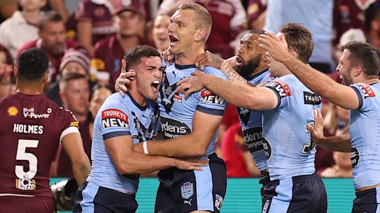 The Blues celebrate their first try.