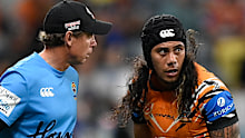 Tigers trainer Brett Hodgson attends to Jarome Luai. 