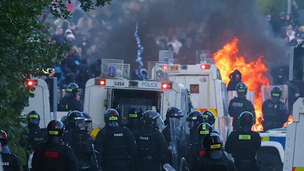 Police attempt to disperse protesters near Newtownabbey, in Belfast.
