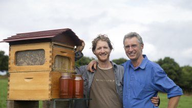 Cedar Anderson and his father Stuart Anderson with their Flow Hive. 