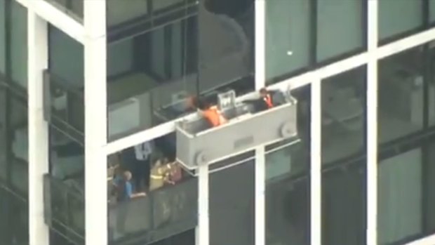 Two window cleaners were stranded on a ledge in high winds, 34 floors above the ground in Melbourne. 