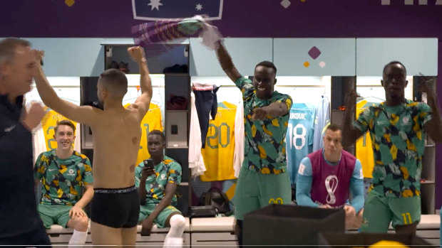 Socceroos player Thomas Deng, centre, celebrates the team’s win against Denmark dancing to ABBA.