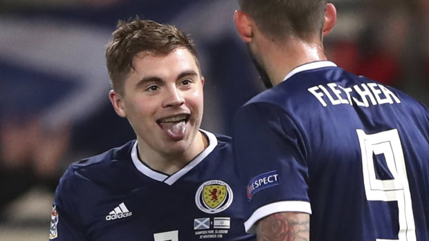 James Forrest celebrates Scotland's third goal.