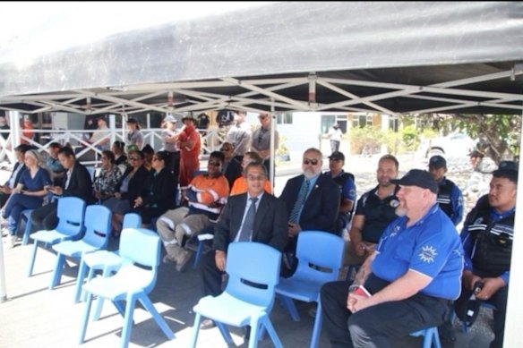 Tim Jones (front row on the right) at an event in Nauru wearing a Nauru Community Services shirt.