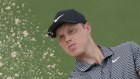 Cam Davis, of Australia, hits from the bunker on the second hole during the first round at the Masters golf tournament.