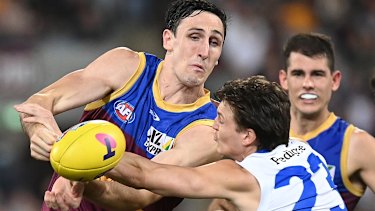 Oscar McInerney is tackled by Laitham Vandermeer.