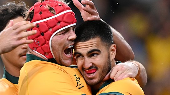 Harry Wilson and Tom Wright celebrate a stunning victory over the All Blacks in Brisbane.