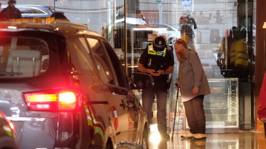 Police outside the Grand Hyatt Hotel in Melbourne, where Australian Open players are staying.