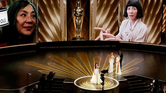 Michelle Yeoh accepts her Oscar for best actress in Everything Everywhere All At Once.