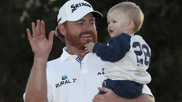 JB Holmes celebrates his Genesis Open victory with his son Tucker.
