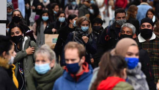 Shoppers wear protective face masks on a crowded street in Brussels, Belgium, on Friday, October 16. Belgium trails only the Czech Republic for new cases per capita in Europe. 