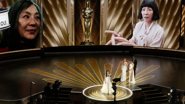 Michelle Yeoh accepts her Oscar for best actress in Everything Everywhere All At Once.