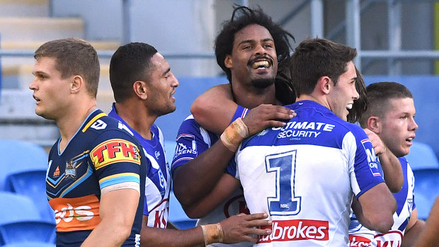 Credit where it's due: Jayden Okunbor is congratulated after scoring against Gold Coast.