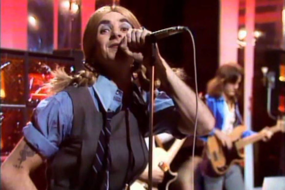 “Disgusting”: AC/DC singer Bon Scott dressed as a schoolgirl for Countdown in 1975.