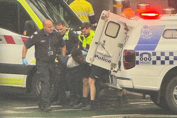 Police officers arrest Jerry Sowood on Wednesday.