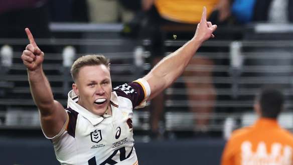Billy Walters of the Broncos celebrates as Reece Walsh of the Broncos crosses to score a try during the round one NRL match between Sydney Roosters and Brisbane Broncos at Allegiant Stadium, on March 02, 2024, in Las Vegas, Nevada. 
