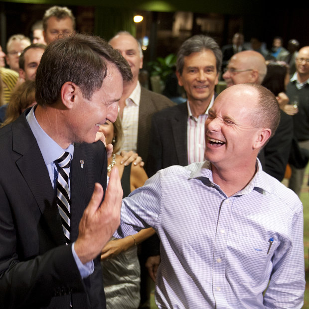 Then lord mayor Graham Quirk (left) with his predecessor, Campbell Newman, after securing a new term in 2012. Weeks earlier, Newman was elected premier of Queensland.