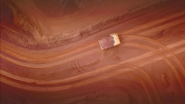 An autonomous truck following precision-like tracks at BHP's Jimblebar mine in WA. 