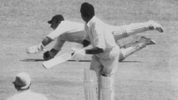 Rodney Marsh dives full length to his right to dismiss World XI captain Garry Sobers for a duck off the bowling of Graeme Watson. December 6, 1971.