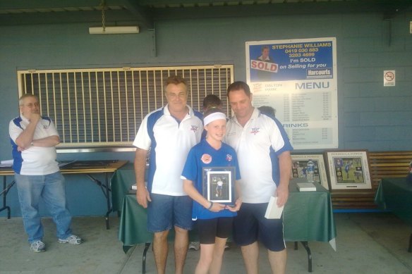 Cortnee Vine with under-12s coach Garry Dye (left) and senior men’s coach Terry Kirkham (right) at a presentation day in 2010.