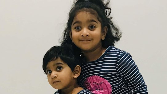 Tharunicaa, left, is pictured with her four-year-old sister Kopika.