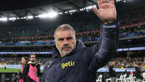 Tottenham Hotspur coach Ange Postecoglou, right, and former Socceroos captain Mile Jedinak thanks fans at the MCG on Wednesday night.