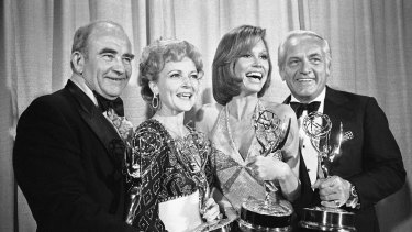 In this May 18, 1976 file photo, cast members of the "Mary Tyler Moore Show," pose with their Emmys backstage, at the 28th annual Emmy Awards in Los Angeles. From left are, Ed Asner, Betty White, Mary Tyler Moore and Ted Knight.  