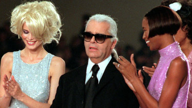 Karl Lagerfeld is applauded by Claudia Schiffer, left, and Naomi Campbell at the end of the Chanel 1997 Spring-Summer ready-to-wear collection show.