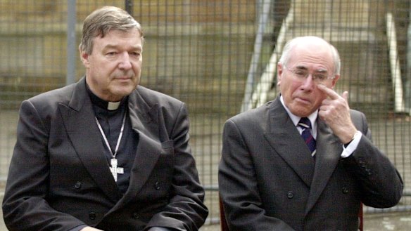 Cardinal George Pell and then prime minister John Howard at a media call at St Benedict's Church in August 2004.