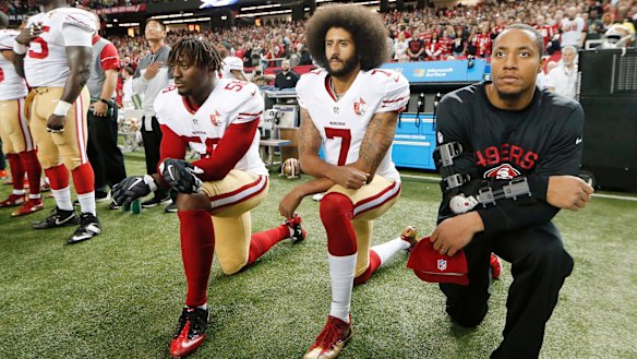 NFL players kneeling during the anthem to raise awareness of racism and social injustice.