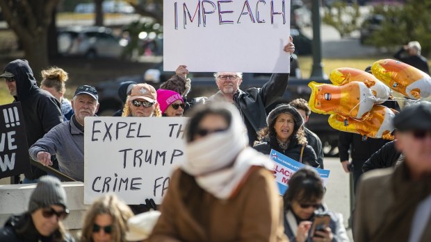 Protesters gather at on the south steps of the Texas State Capitol in Austin in support of impeachment of US President Donald Trump.