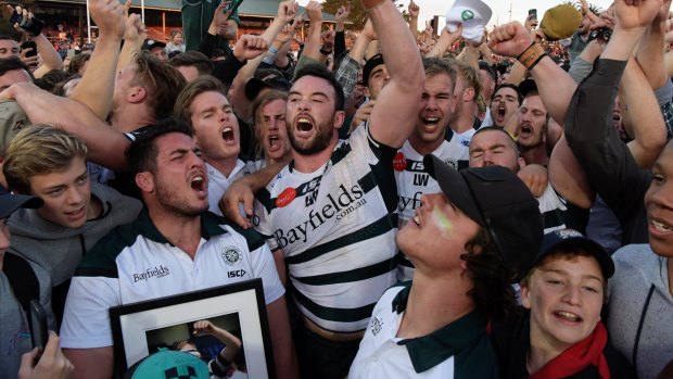 Alive and well: Warringah players and fans celebrate their Shute Shield success at the 2017 grand final.