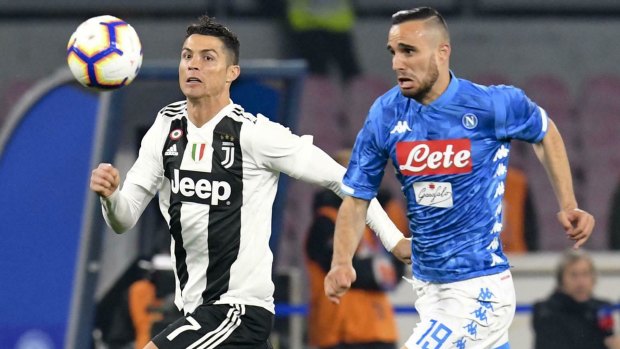 Juventus' Cristiano Ronaldo (left) and Napoli's Nikola Maksimovic vie for the ball.