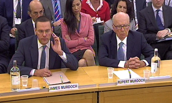 James Murdoch, pictured giving evidence with his father Rupert before the UK's Culture, Media and Sport Select Committee, survived fallout from the News of the World phone-hacking scandal.